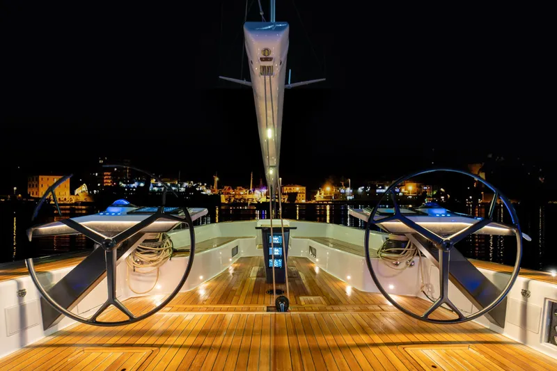  Yacht Photos Pics Luxurious 2026 Ice Yachts 70 with dual steering wheels, illuminated at night.