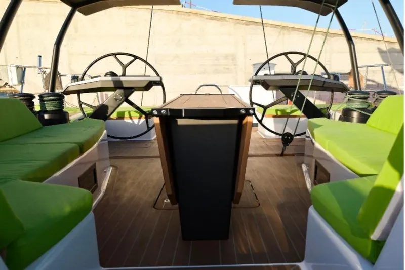  Yacht Photos Pics Luxurious 2026 Ice Yachts 70 cockpit with green seating and dual steering wheels.