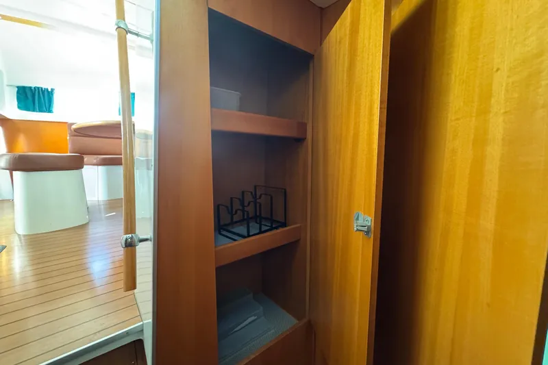 Wayward Sun Yacht Photos Pics Interior of 2000 Lagoon 380 yacht with wooden cabinetry and seating area.