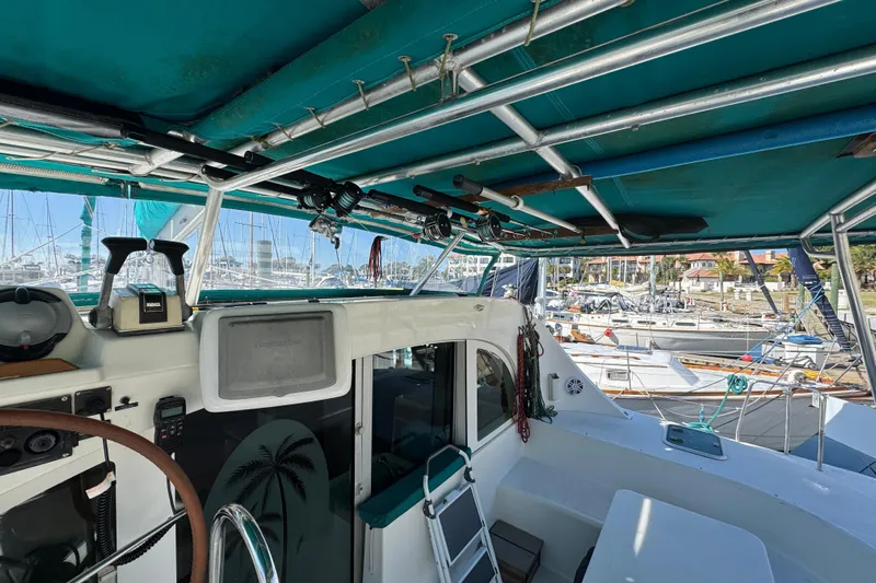 Wayward Sun Yacht Photos Pics Interior view of a 2000 Lagoon 380 catamaran docked at a marina.