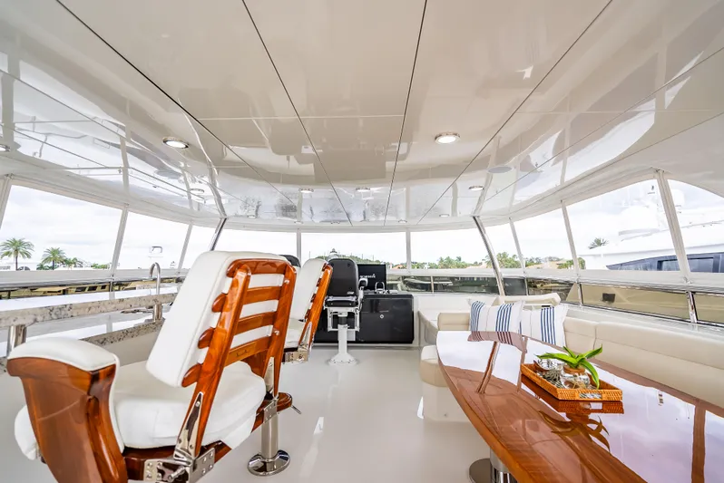 Crumdale Yacht Photos Pics Luxurious interior of 2018 Ocean Alexander 85 E yacht with elegant seating and polished wood table.