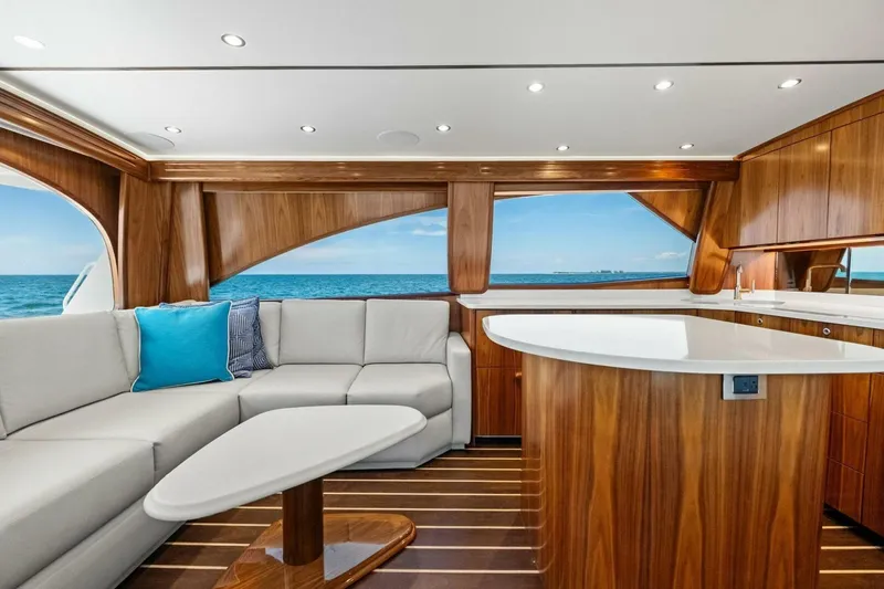 Galati Yacht Sales Trade Yacht Photos Pics Luxurious interior of 2025 Viking 58 Convertible yacht with ocean view.