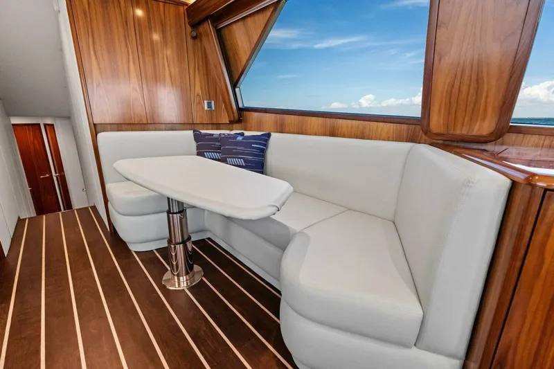 Galati Yacht Sales Trade Yacht Photos Pics Luxurious interior of 2025 Viking 58 Convertible yacht with elegant seating and ocean view.