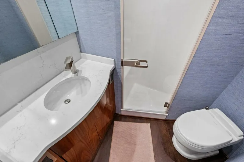 Galati Yacht Sales Trade Yacht Photos Pics Luxurious bathroom in 2025 Viking 58 Convertible yacht with modern fixtures and elegant design.