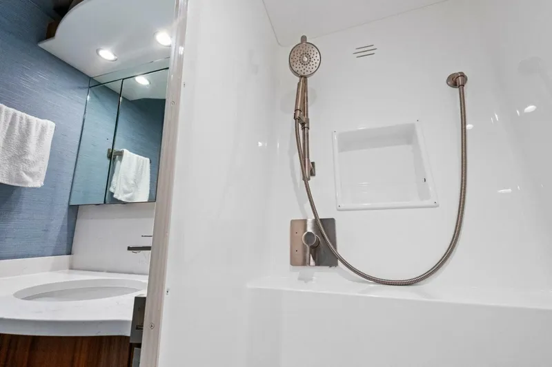 Galati Yacht Sales Trade Yacht Photos Pics Modern bathroom in 2025 Viking 58 Convertible yacht with sleek shower and vanity.