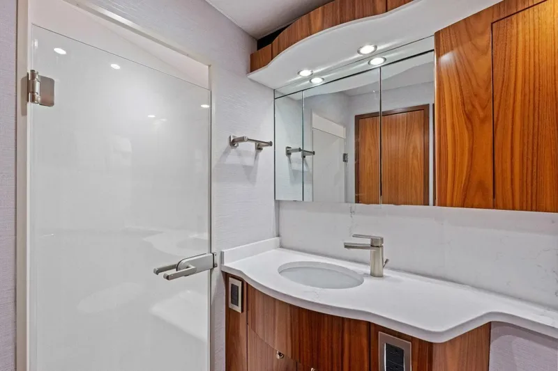 Galati Yacht Sales Trade Yacht Photos Pics Luxurious bathroom interior of 2025 Viking 58 Convertible yacht with modern fixtures.