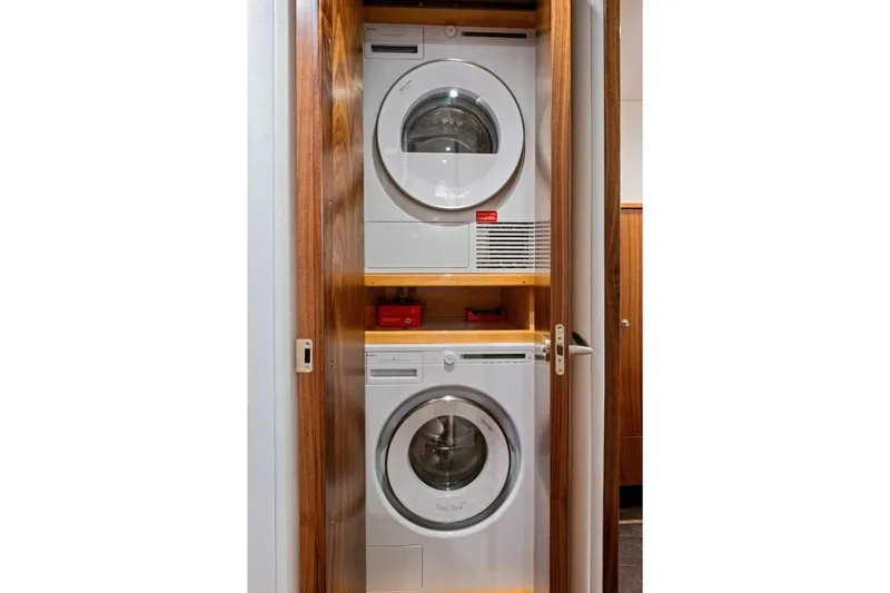 Galati Yacht Sales Trade Yacht Photos Pics Stacked washer and dryer in 2025 Viking 58 Convertible yacht interior.