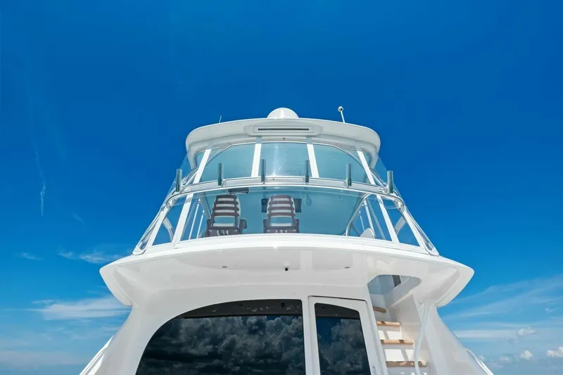 Galati Yacht Sales Trade Yacht Photos Pics 2025 Viking 58 Convertible yacht against a clear blue sky, showcasing sleek design.