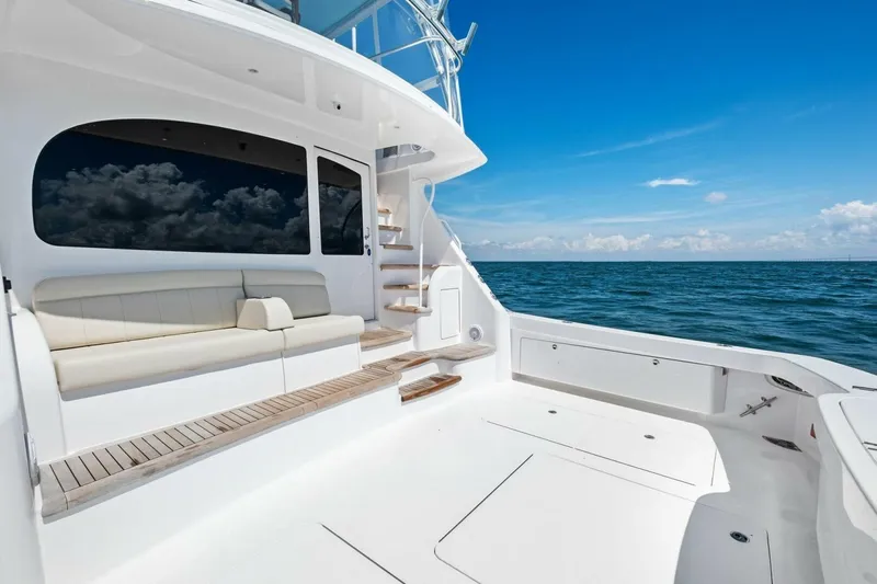 Galati Yacht Sales Trade Yacht Photos Pics 2025 Viking 58 Convertible yacht deck with seating, ocean view, and blue sky.
