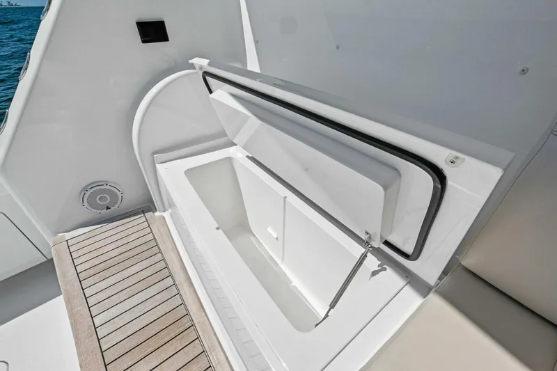Galati Yacht Sales Trade Yacht Photos Pics Open storage compartment on 2025 Viking 58 Convertible yacht deck.