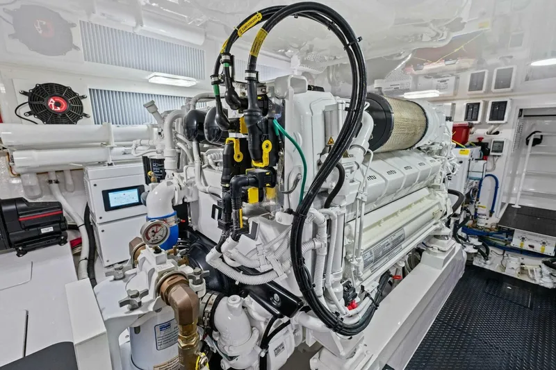 Galati Yacht Sales Trade Yacht Photos Pics Engine room of 2025 Viking 58 Convertible yacht, showcasing advanced machinery and components.