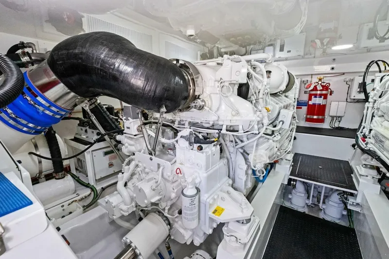 Galati Yacht Sales Trade Yacht Photos Pics Engine room of 2025 Viking 58 Convertible yacht, featuring advanced machinery and fire safety equipment.