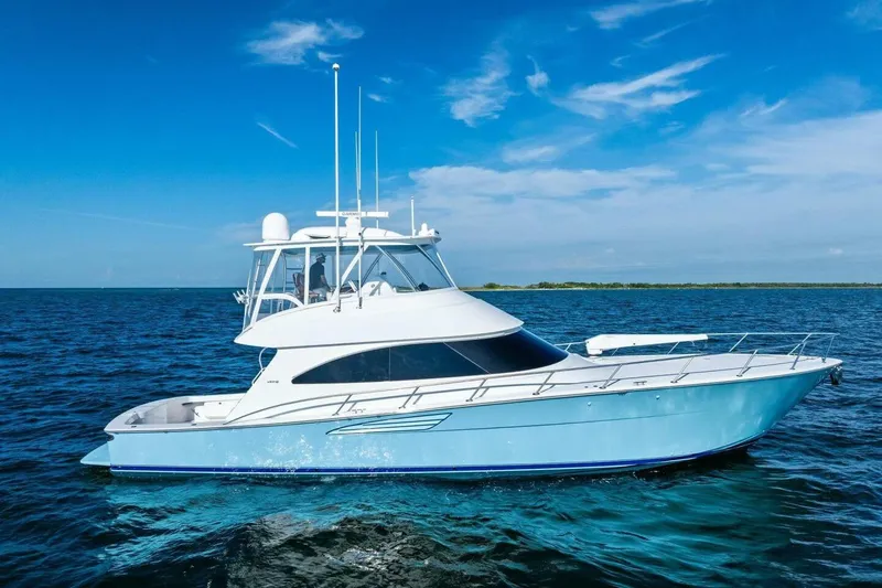 Galati Yacht Sales Trade Yacht Photos Pics 2025 Viking 58 Convertible yacht cruising on open blue ocean under clear sky.