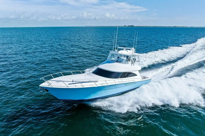 Galati Yacht Sales Trade Yacht Photos Pics 2025 Viking 58 Convertible yacht cruising on open ocean waters.