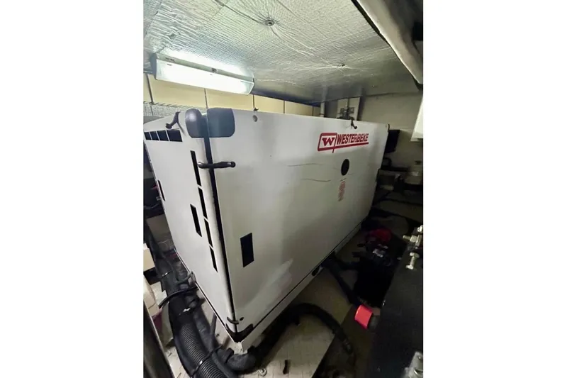  Yacht Photos Pics Engine room of 2001 Sea Ray 560 Sedan Bridge with Westerbeke generator.