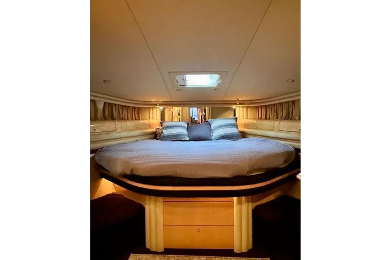 Yacht Photos Pics Luxurious bedroom interior of 2001 Sea Ray 560 Sedan Bridge yacht.