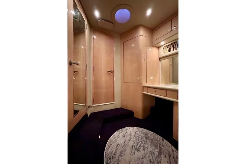  Yacht Photos Pics Luxurious interior of 2001 Sea Ray 560 Sedan Bridge yacht with elegant wood finishes.