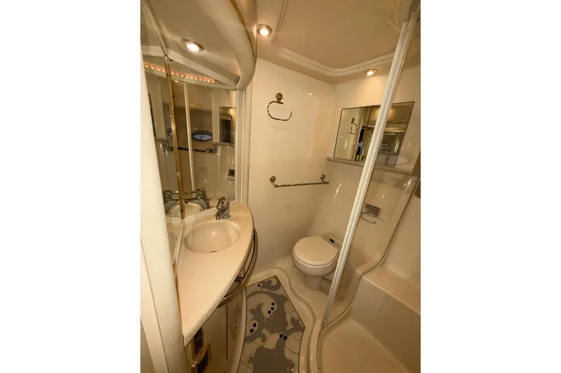  Yacht Photos Pics Luxurious bathroom in 2001 Sea Ray 560 Sedan Bridge yacht, featuring modern fixtures and elegant design.