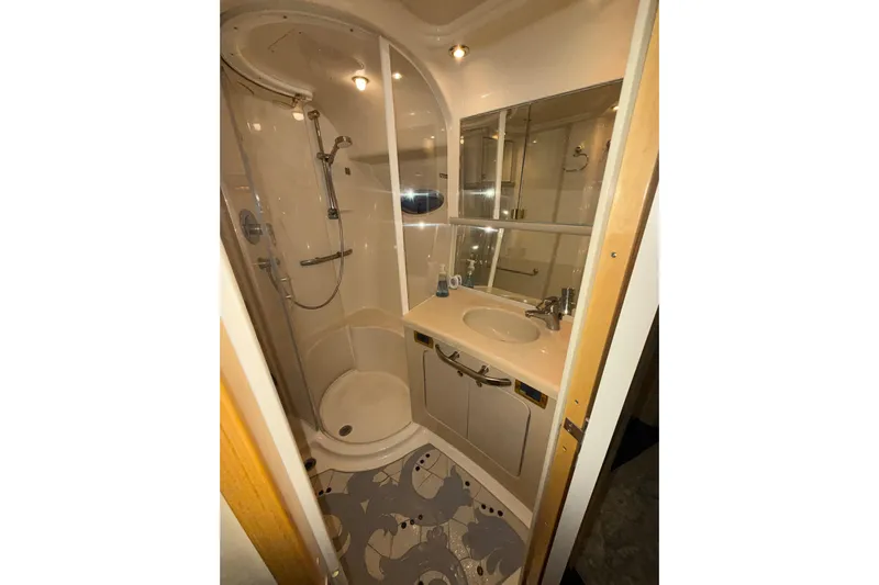  Yacht Photos Pics Luxurious bathroom in 2001 Sea Ray 560 Sedan Bridge yacht with shower and vanity.