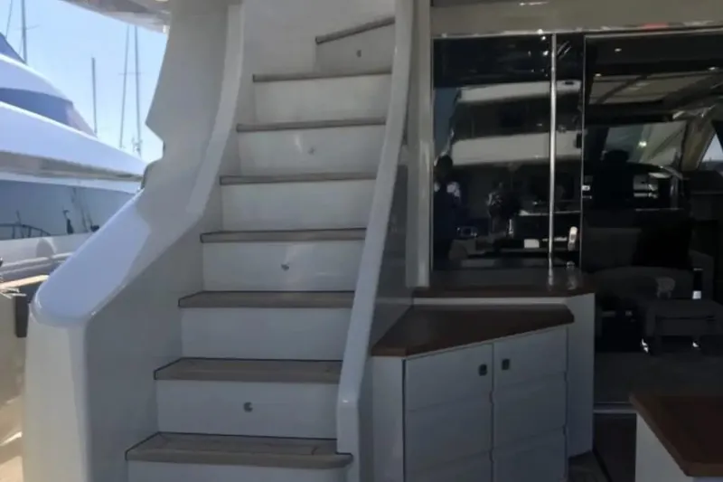  Yacht Photos Pics Staircase on a 2010 Azimut 103S yacht, leading to upper deck.