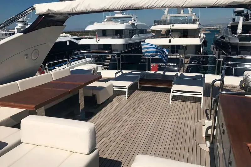  Yacht Photos Pics Luxurious 2010 Azimut 103S yacht deck with elegant seating and dining area.