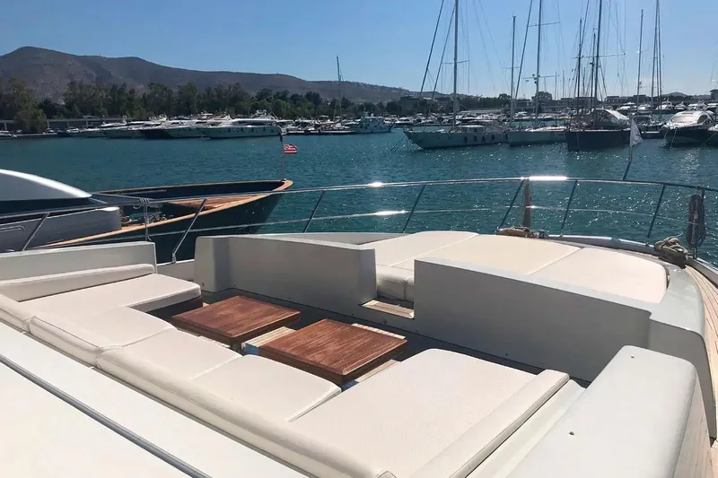  Yacht Photos Pics Luxurious 2010 Azimut 103S yacht deck with sun loungers in a marina setting.