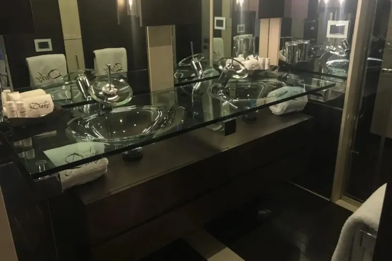  Yacht Photos Pics Luxurious bathroom interior on 2010 Azimut 103S yacht with glass sink and elegant fixtures.