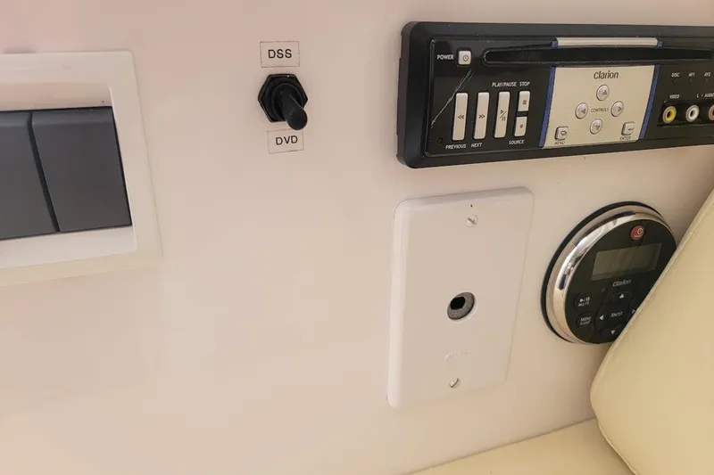  Yacht Photos Pics Control panel of a 2010 Intrepid 39 Kevlar Hull yacht with audio system and switches.