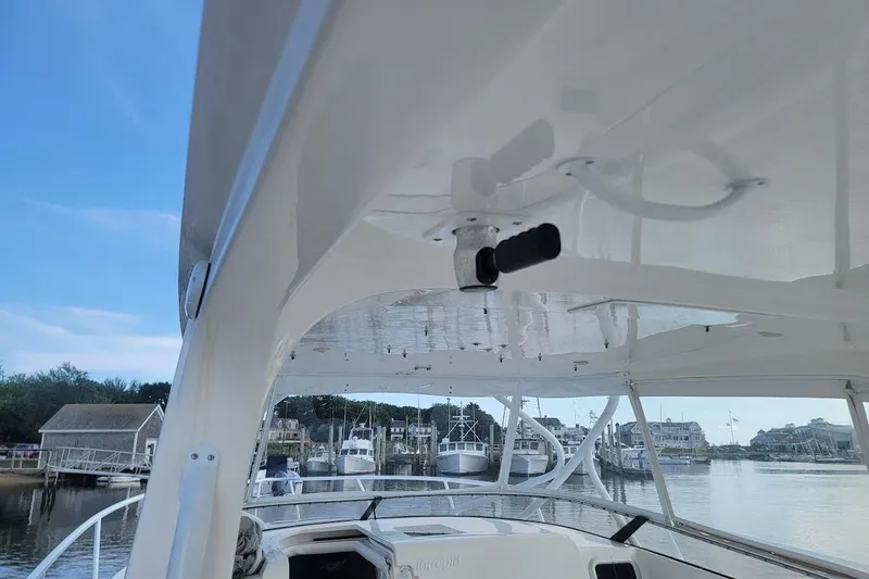  Yacht Photos Pics 2010 Intrepid 39 Kevlar Hull yacht docked at marina, showcasing sleek design and spacious deck.