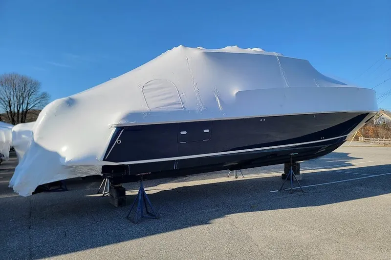  Yacht Photos Pics 2010 Intrepid 39 Kevlar Hull Sport Yacht covered in protective wrap on stands.