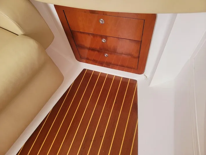  Yacht Photos Pics Interior of 2010 Intrepid 39 Kevlar Hull yacht with wooden drawers and striped flooring.