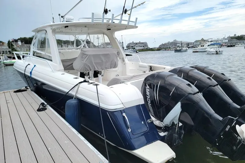  Yacht Photos Pics 2010 Intrepid 39 Kevlar Hull Sport Yacht docked, featuring powerful Mercury outboard engines.