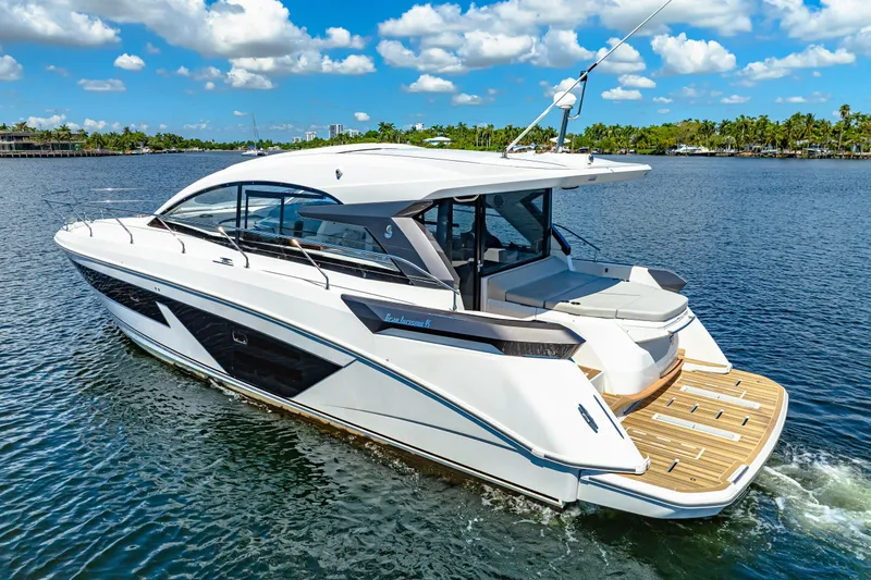  Yacht Photos Pics 2024 Beneteau Gran Turismo 45 yacht cruising on a sunny day, showcasing sleek design.