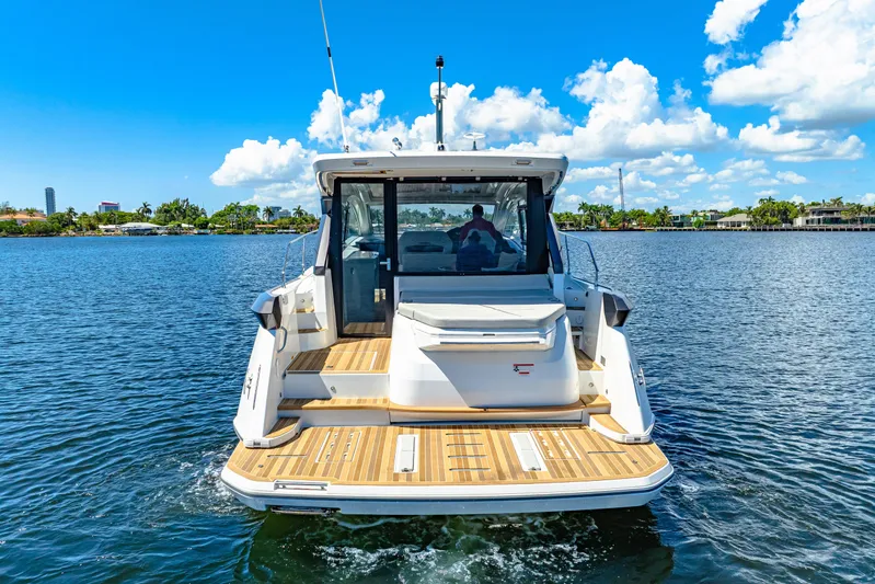  Yacht Photos Pics 2024 Beneteau Gran Turismo 45 yacht on water, rear view, sunny day.
