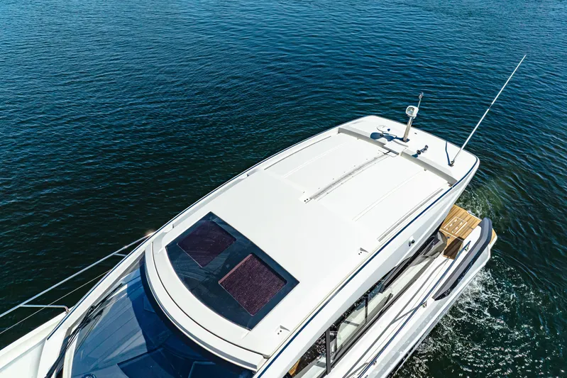  Yacht Photos Pics 2024 Beneteau Gran Turismo 45 yacht cruising on open water.