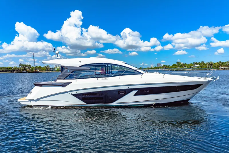  Yacht Photos Pics 2024 Beneteau Gran Turismo 45 yacht cruising on a sunny day with blue skies.