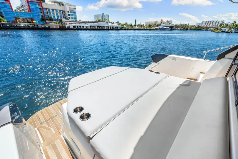  Yacht Photos Pics 2024 Beneteau Gran Turismo 45 yacht with sun deck, overlooking sparkling blue water.