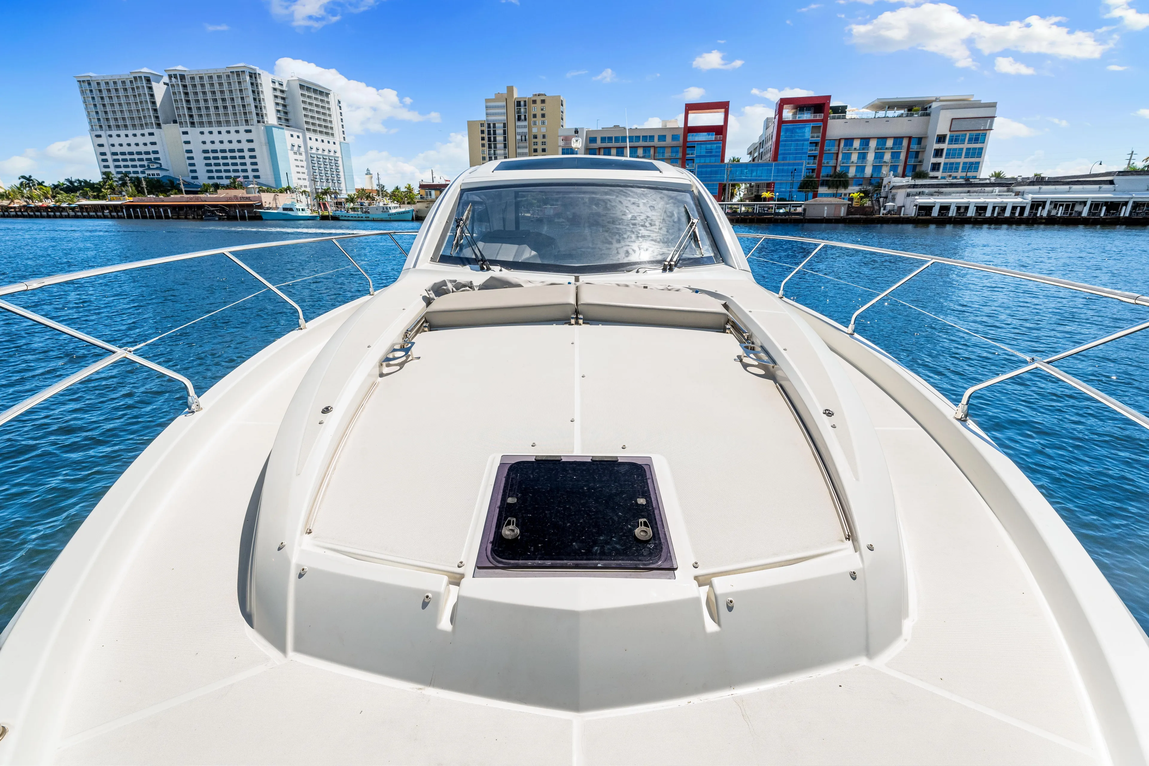  Yacht Photos Pics 2024 Beneteau Gran Turismo 45 yacht on water with cityscape background.