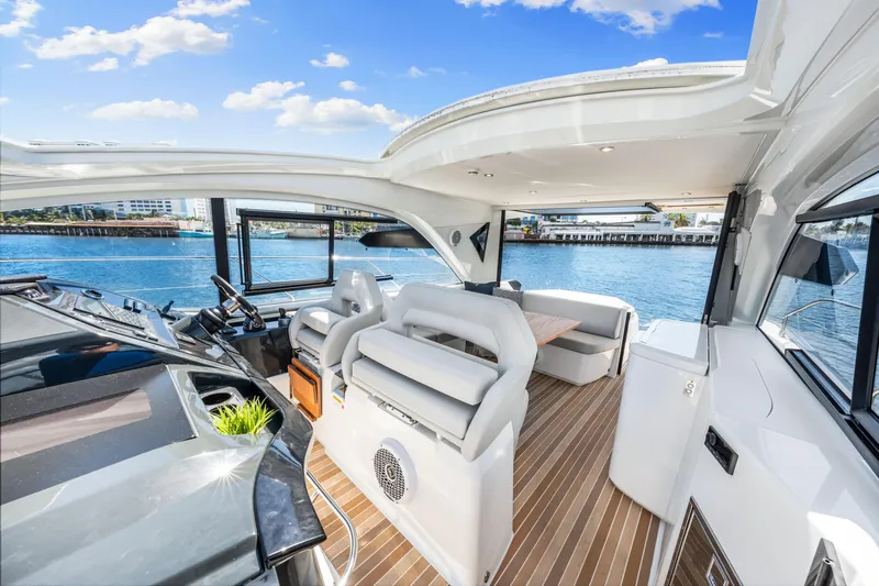  Yacht Photos Pics Luxurious interior of 2024 Beneteau Gran Turismo 45 yacht with scenic water view.