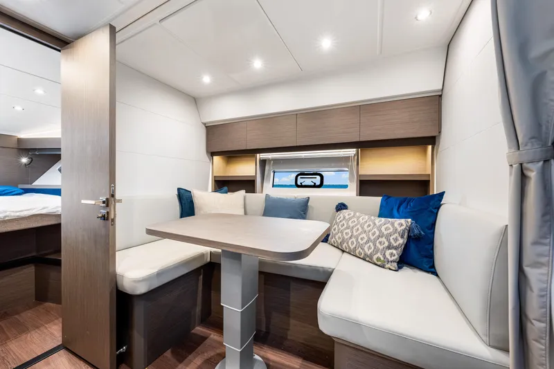  Yacht Photos Pics Luxurious interior of 2024 Beneteau Gran Turismo 45 yacht with elegant seating and modern decor.