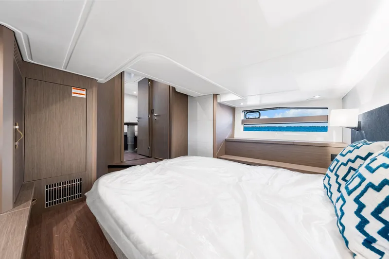  Yacht Photos Pics Luxurious cabin interior of 2024 Beneteau Gran Turismo 45 yacht with ocean view.