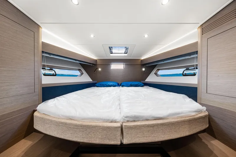 Yacht Photos Pics Luxurious cabin interior of 2024 Beneteau Gran Turismo 45 yacht, featuring modern design and comfort.