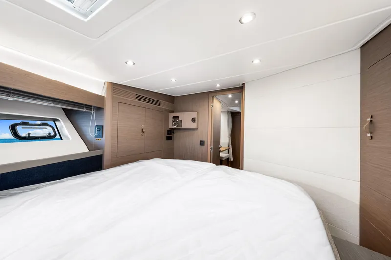  Yacht Photos Pics Luxurious cabin interior of 2024 Beneteau Gran Turismo 45 yacht, featuring modern design and cozy ambiance.