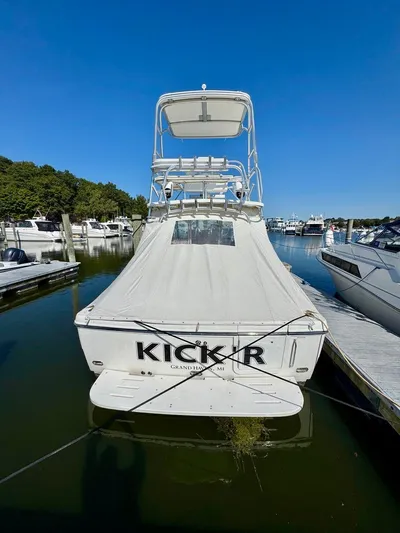  Yacht Photos Pics 2006 Rampage 33 Express boat docked in marina under clear blue sky.