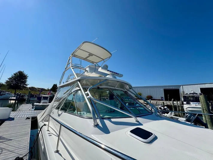 Yacht Photos Pics 2006 Rampage 33 Express boat docked under clear blue sky.