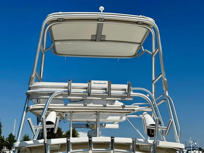  Yacht Photos Pics 2006 Rampage 33 Express boat tower against clear blue sky.