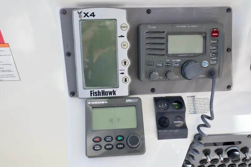  Yacht Photos Pics Boat dashboard with FishHawk, Icom, and Furuno electronics on 2006 Rampage 33 Express.