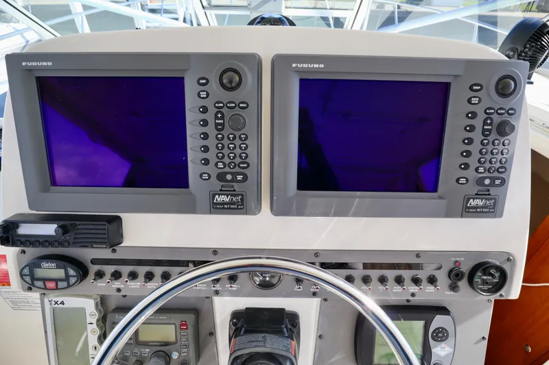  Yacht Photos Pics 2006 Rampage 33 Express boat dashboard with dual Furuno NAVnet displays.