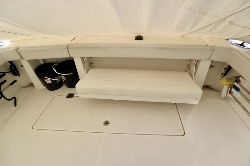  Yacht Photos Pics 2006 Rampage 33 Express boat interior with seating and storage compartments.