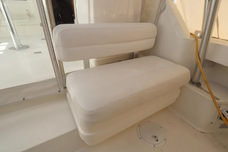  Yacht Photos Pics White seating area on 2006 Rampage 33 Express boat interior.